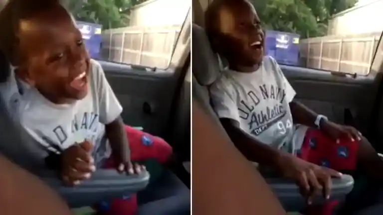 Black kid laughing in car meme photo original 2014 viral moment