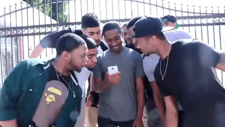 Group of friends reacting and running after looking at a phone, original 2014 A yo Come Look at This meme in full-screen quality